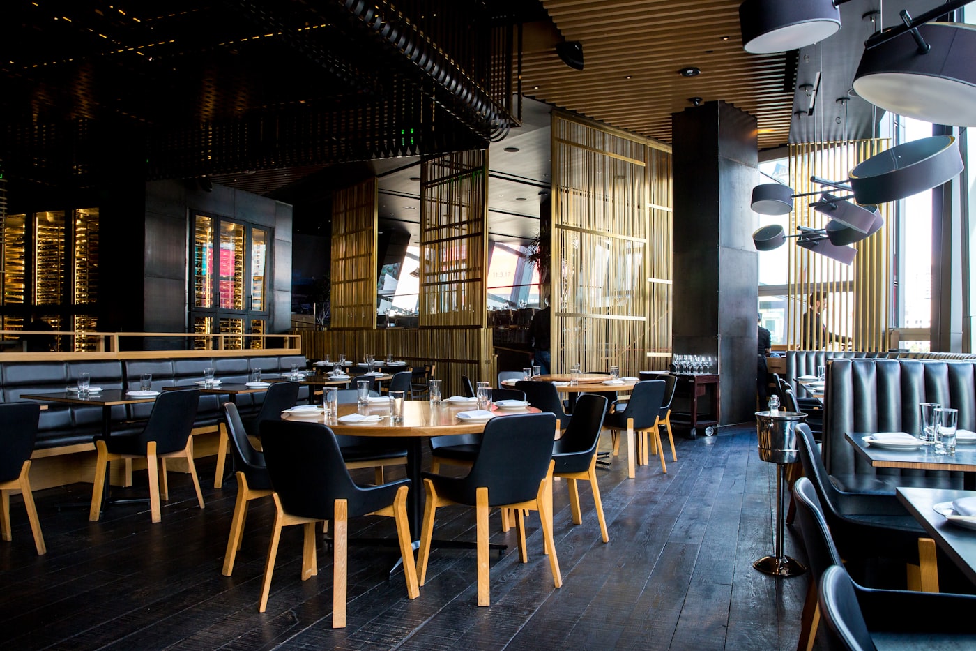 The warm, candle-lit dining room at The Gilded Hare
